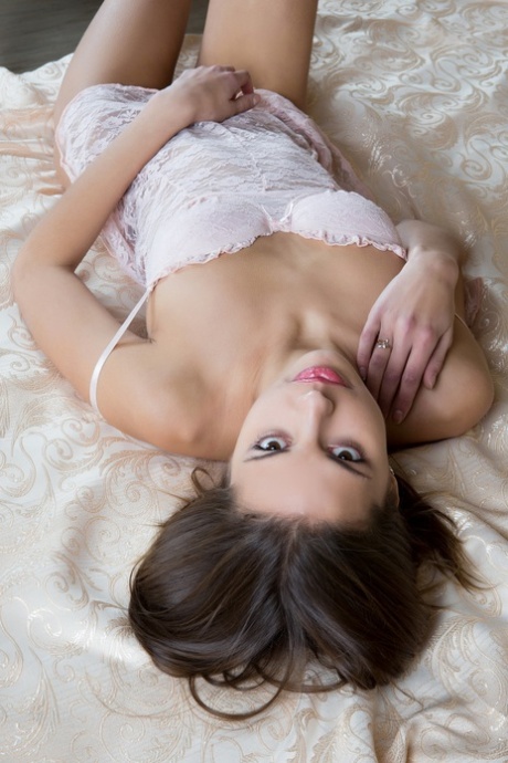 brunette on bed spread eagle art porn img